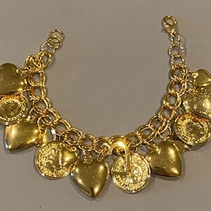 New without Tags Gold Overlay Heart Lockets and Coin Charm Bracelet 
34.34gr